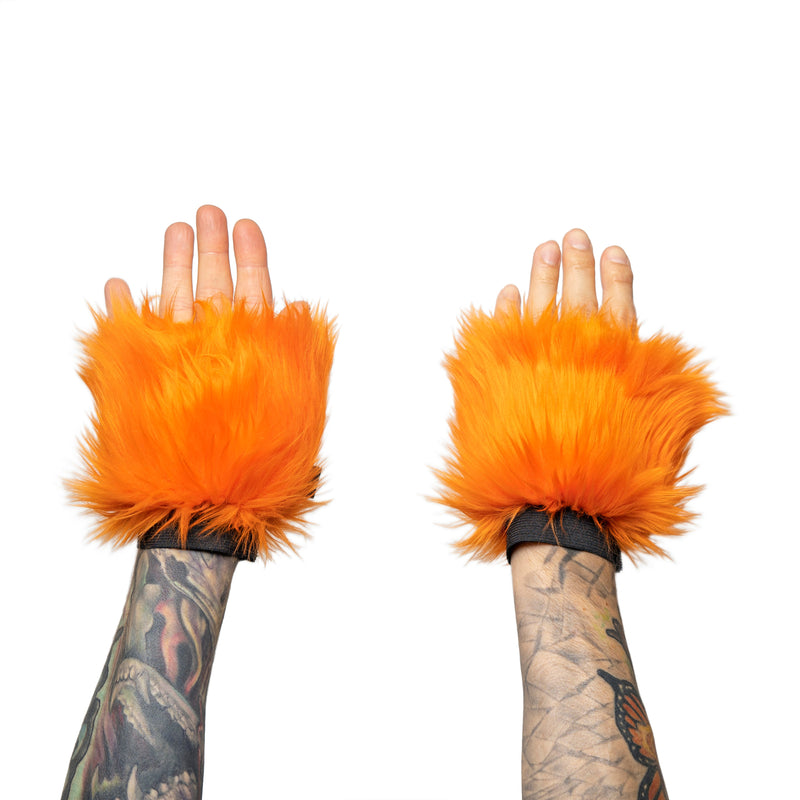 orange Monster Fur Fluffy Cuffs by Pawstar! Furry wrist cuffs made from faux fur for raves, cosplays, halloween, music festivals, and more.